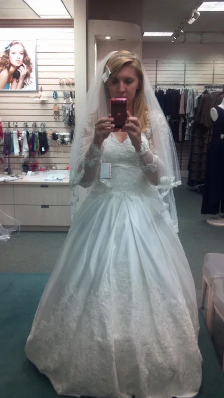 Get It Before It’s Gone!David's Bridal Long Sleeve Satin and Lace Ball Gown